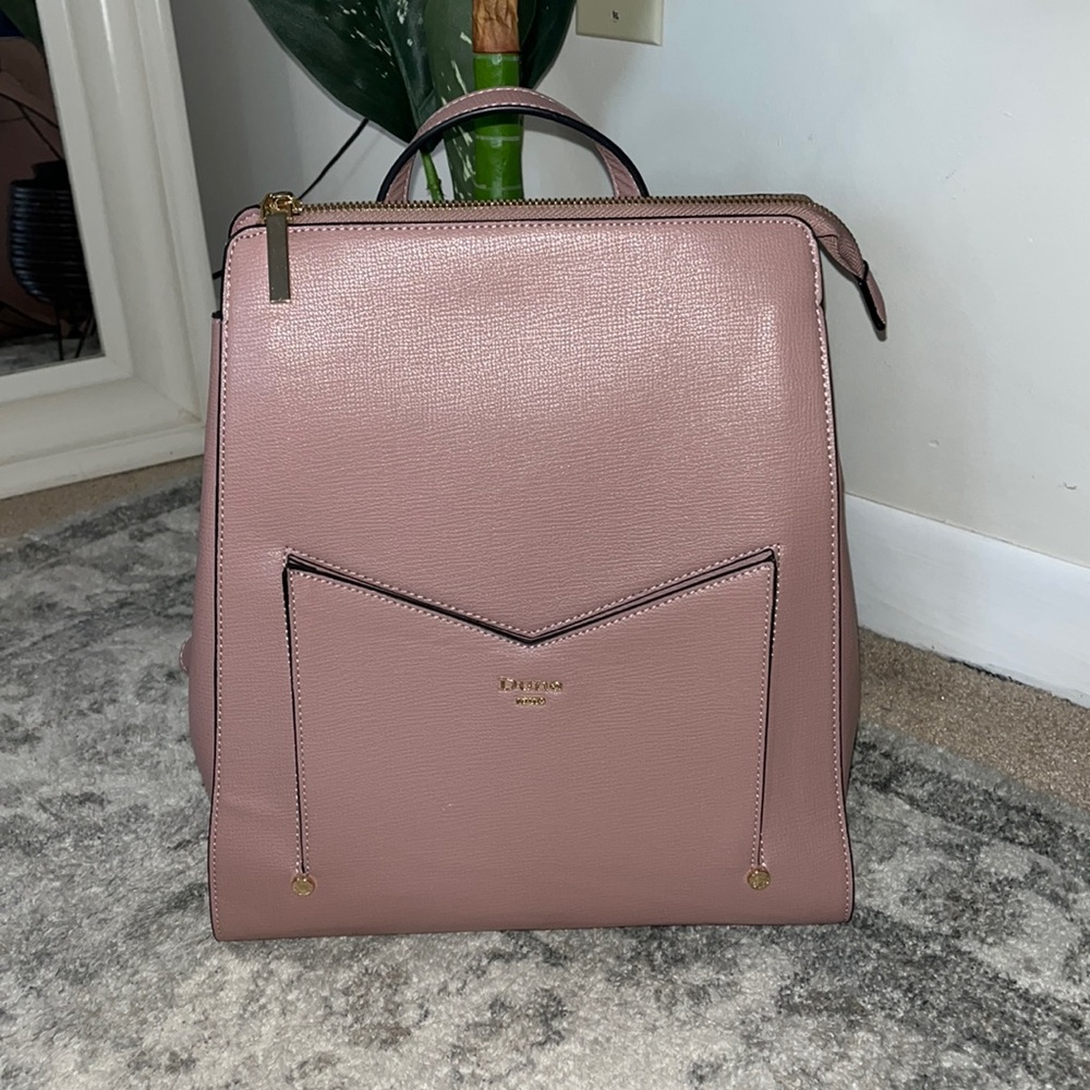 Dune London faux leather bag in a muted rose color. Gold hardware. Very sturdy.